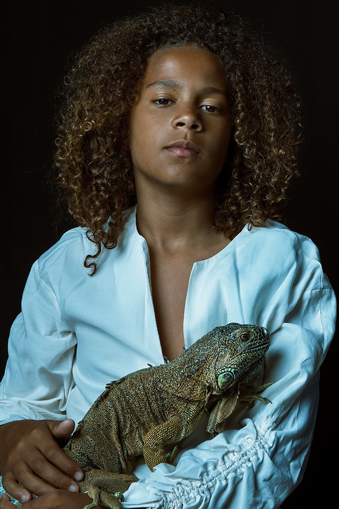Boy with iguana