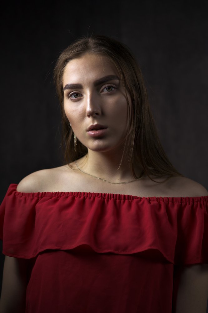 Portrait of a young woman in red dress
