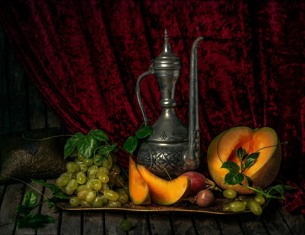 Teapot. Melon. Grapes.