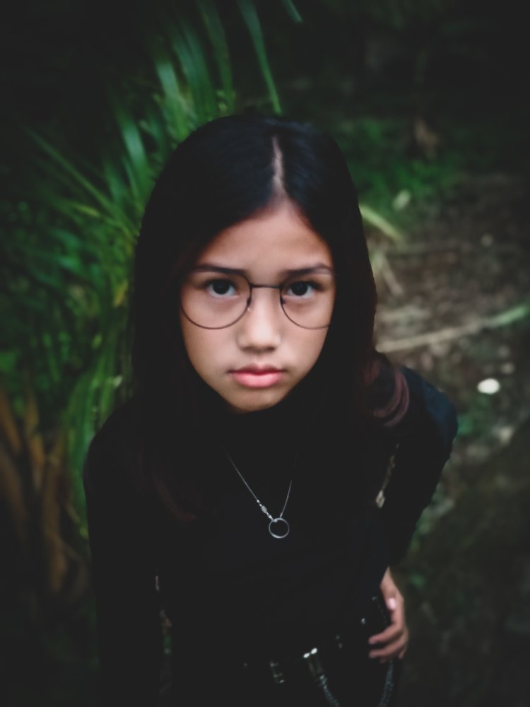 Potrait little child Asian women with glasses so look beatiful