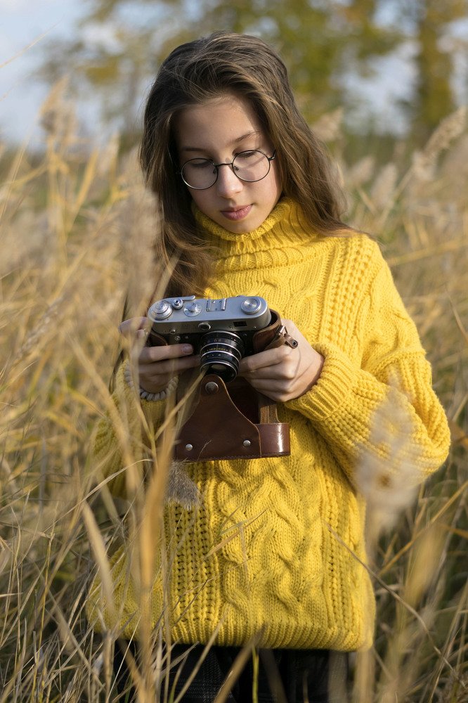 Девочка  с фотоаппаратом