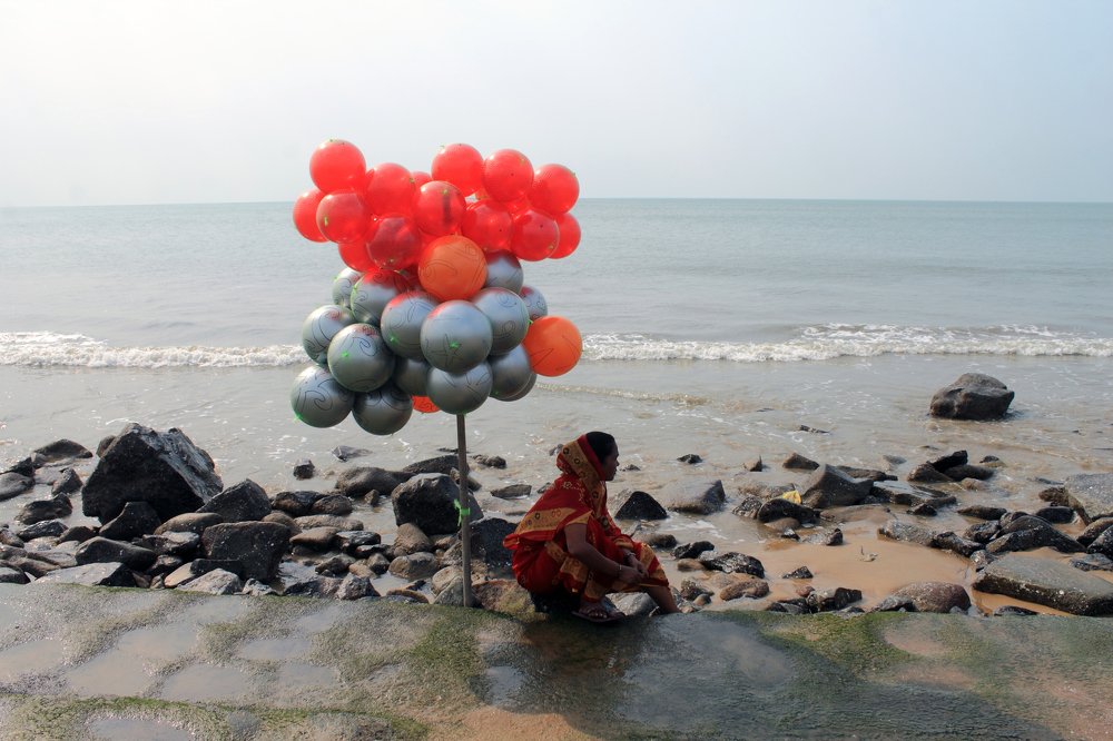 She is near the sea.