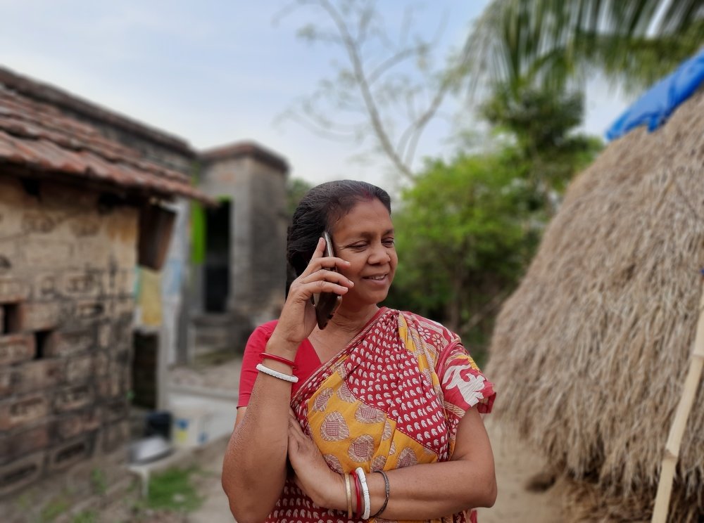 My mon talking on the mobile,and looking little bit happy...