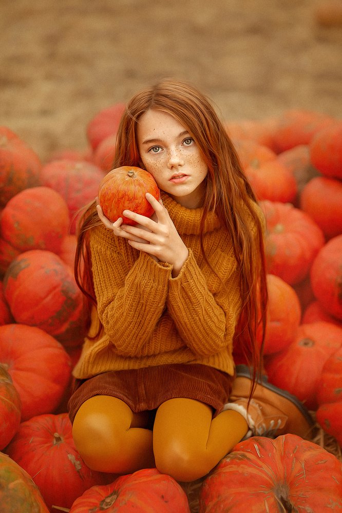 A girl and a pumpkin