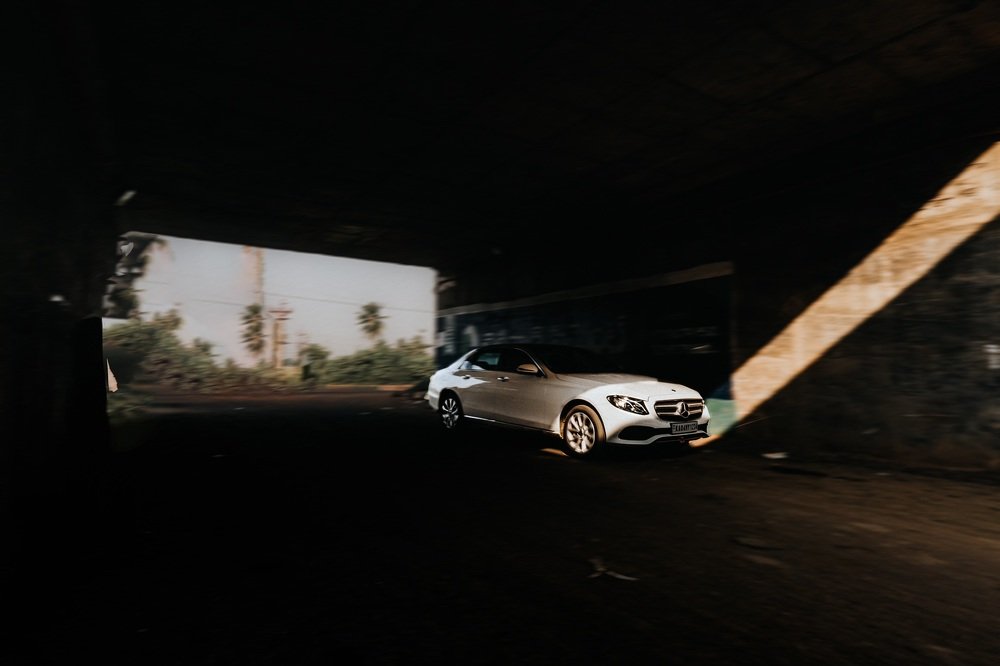 Panning shot of a car moving in a tunnel