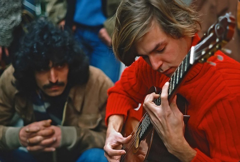 young classical guitarist in the street of Paris