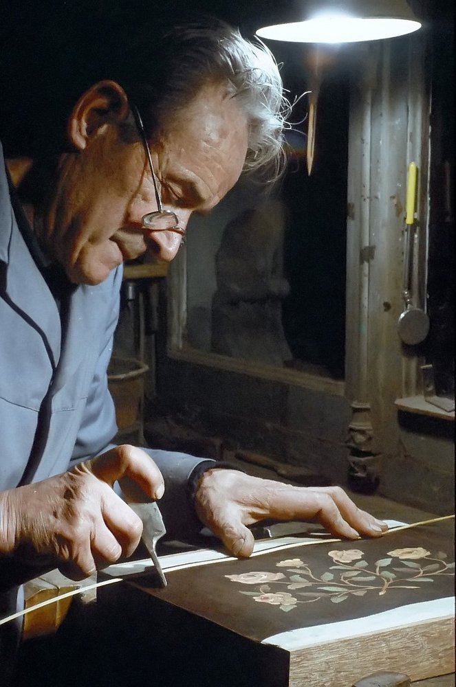 craftsman cabinetmaker working on marquetry