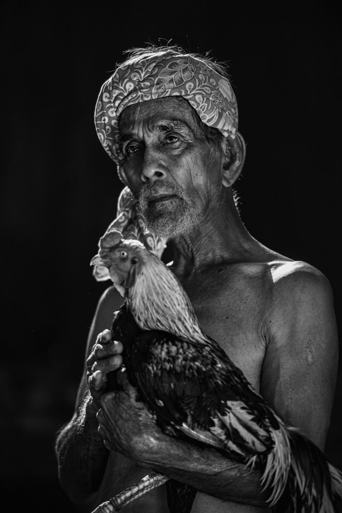 Old village man with his pet.