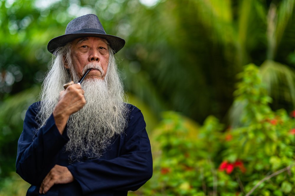 Man Holding Tobacco Pipe