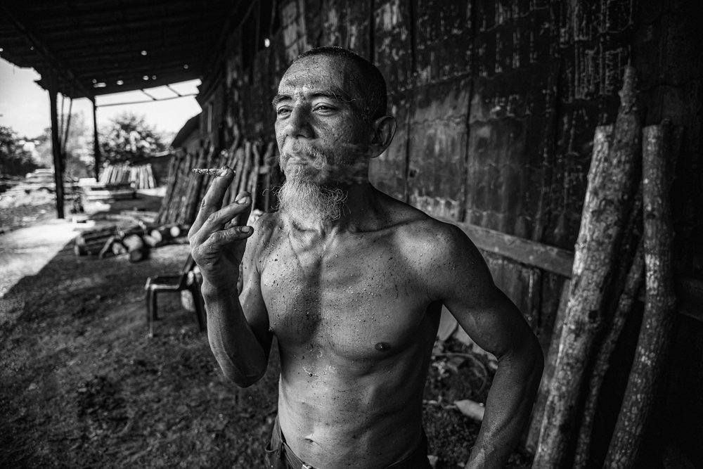 The worker having his cigarette while take a rest.