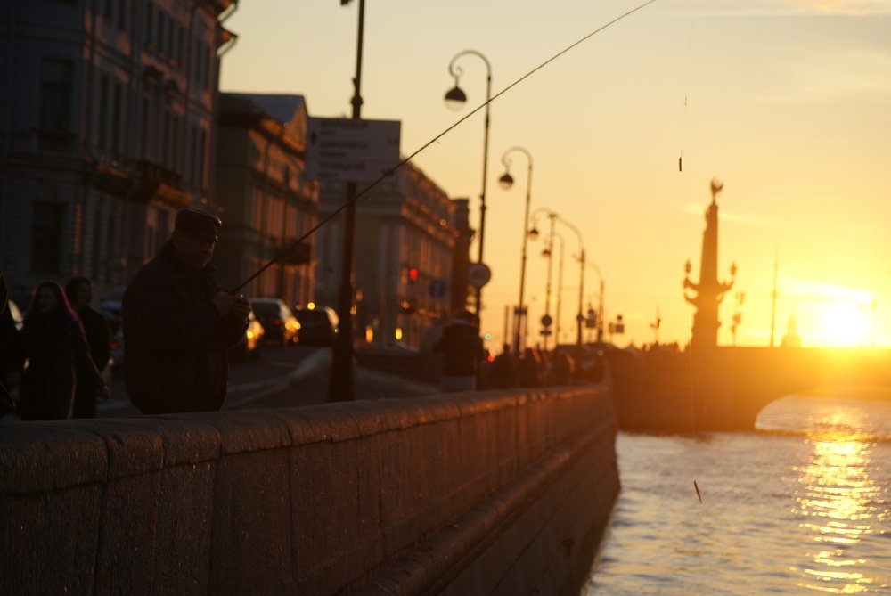 Fisherman on the embankment of the Neva