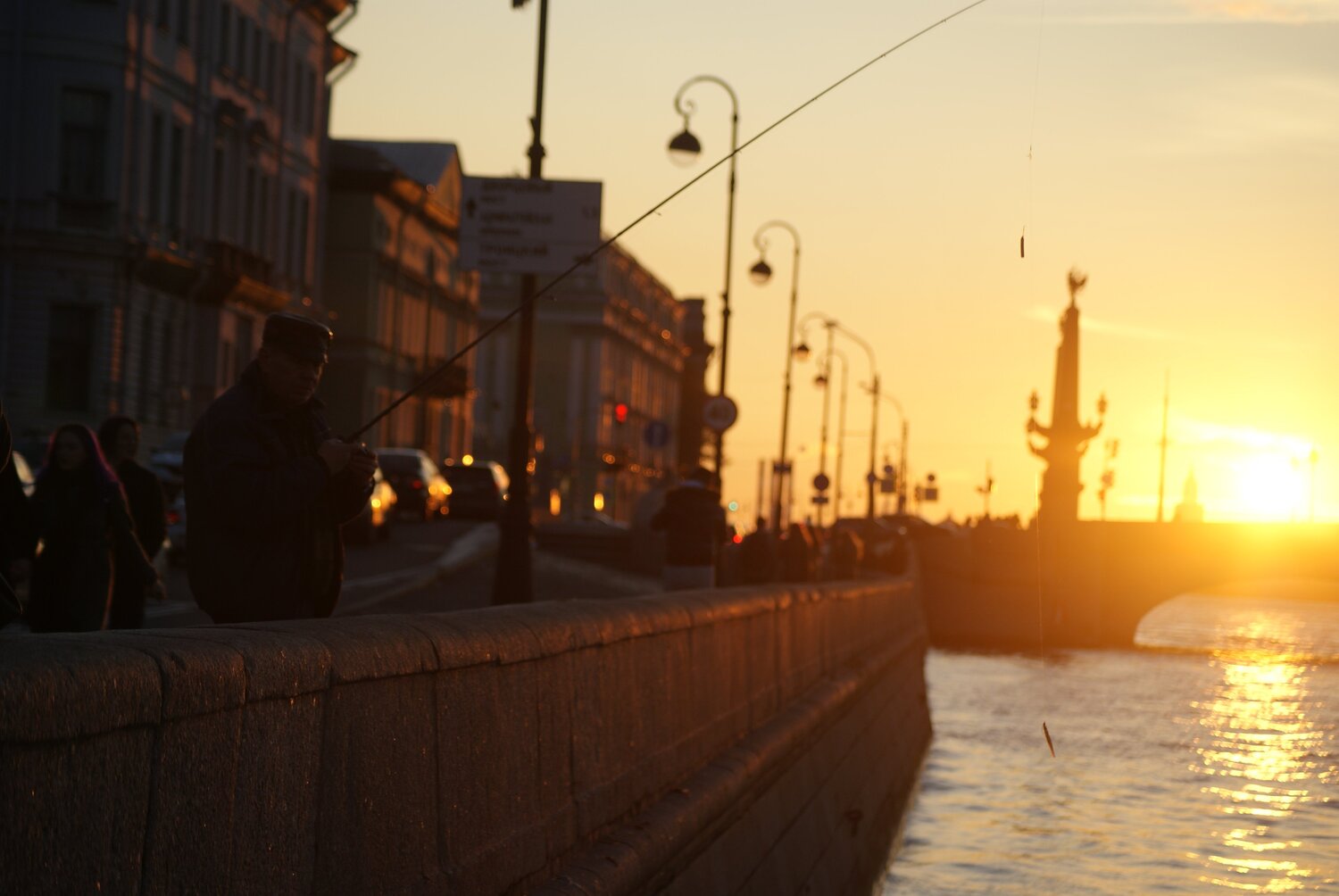 Fisherman on the embankment of the Neva
