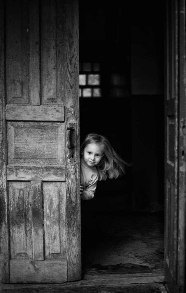 Funny girl at the door