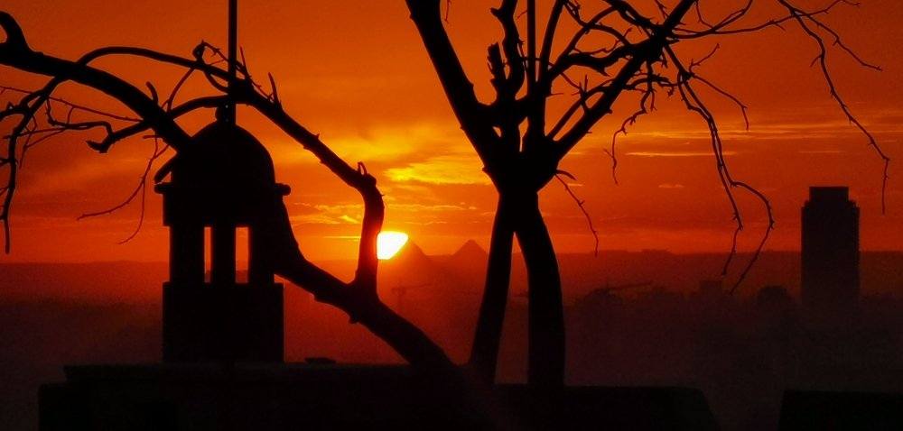Sun kissing the pyramids