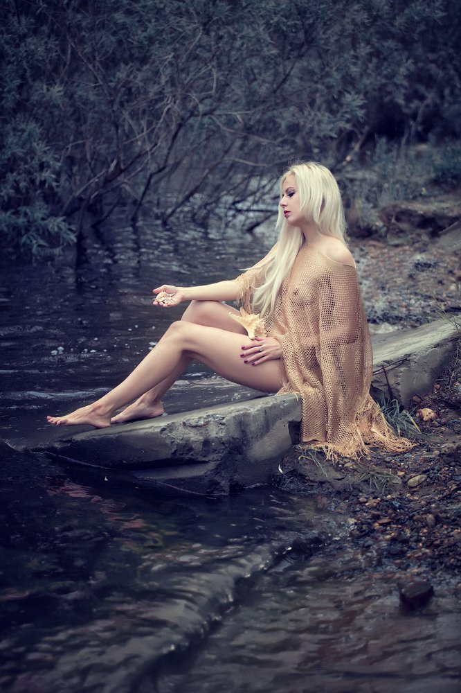 Простилась русалка с хвостом