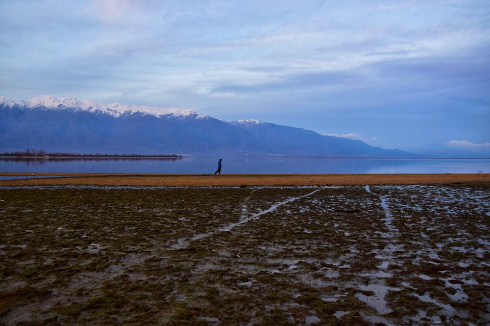 A man walking on Kerkini lake, Greece