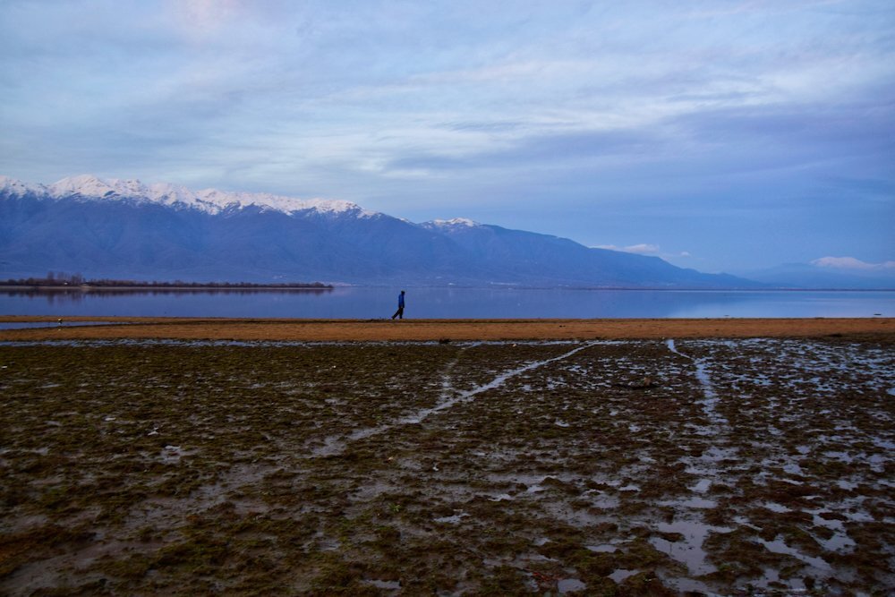 A man walking on Kerkini lake, Greece