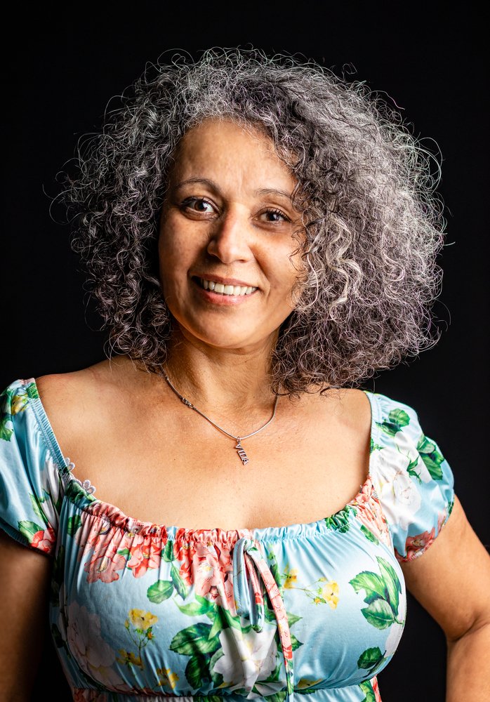 Vibrant woman portrait with beautiful smile on black background
