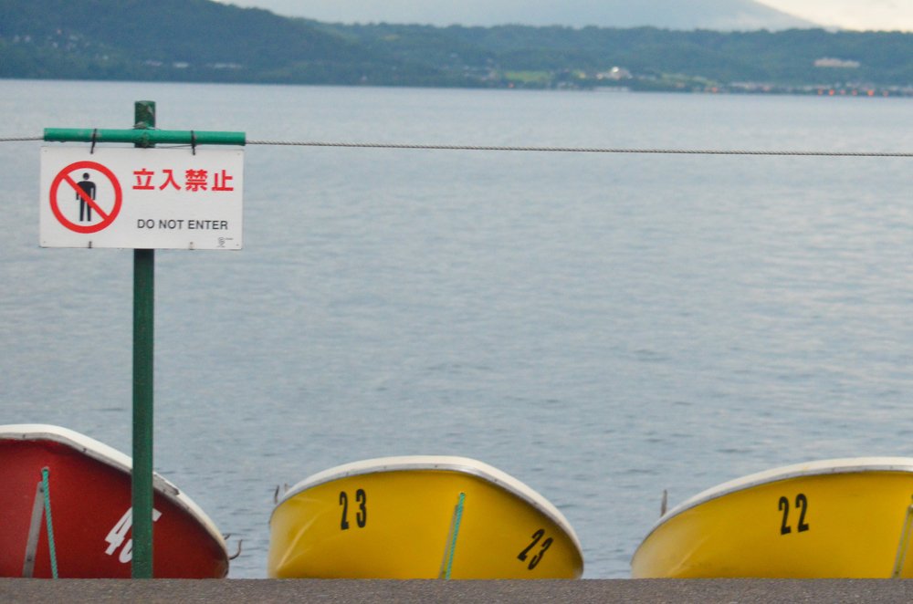 yellow and red boats in a row