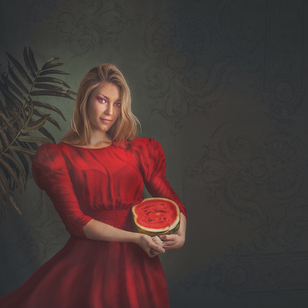 Dangerous woman in red dress with watermelon