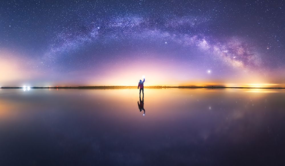 Man over water and stars