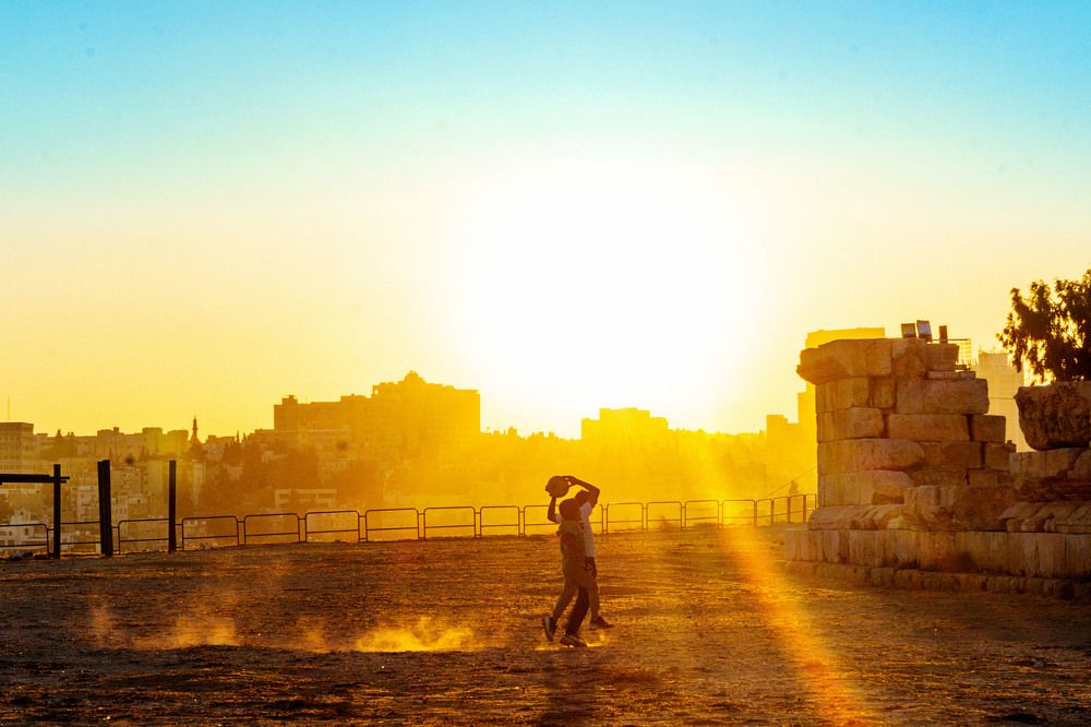 Children playing footballs at sunset, Amman, Jordan