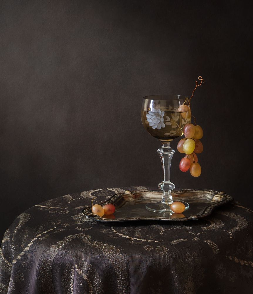 С фужером белого вина.