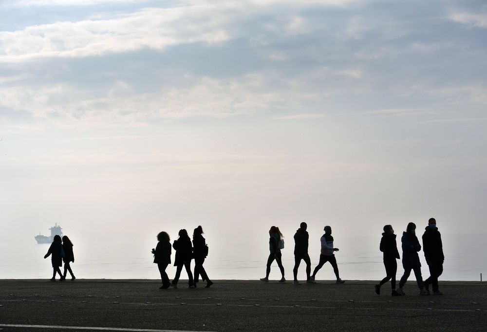 Human ghostlike silluets on the city during covid-19 period 2020