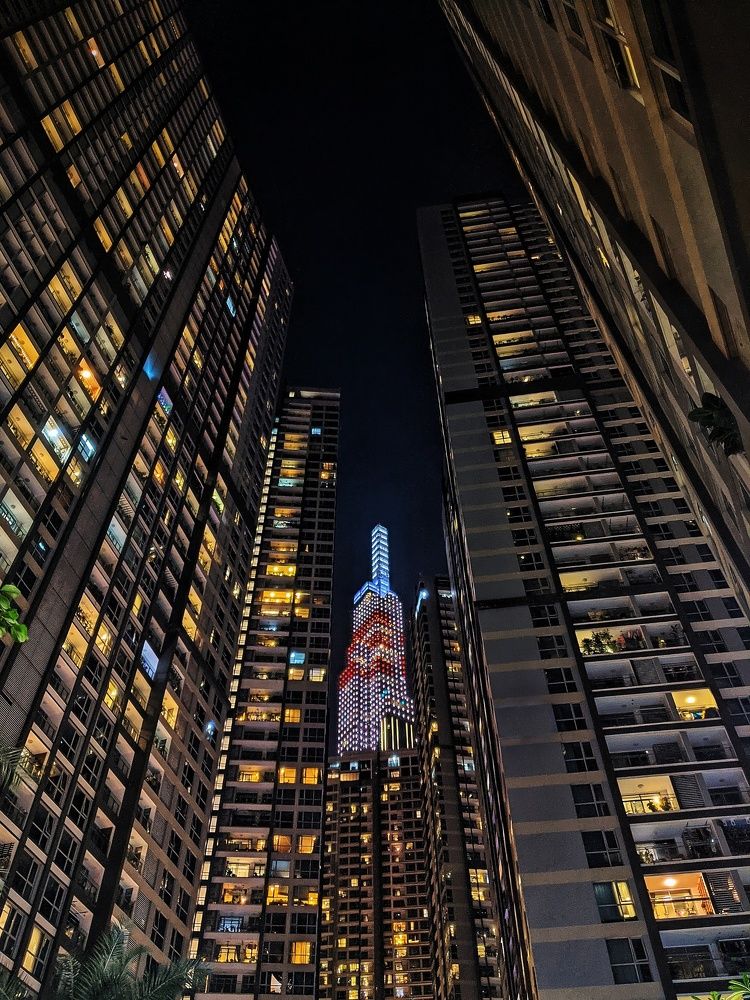 Landmark 81 in between buildings.