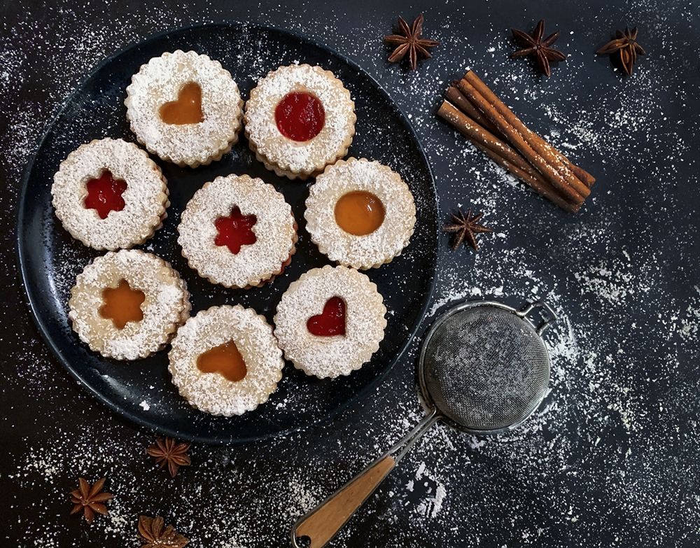 Linzer cookies on dark background.