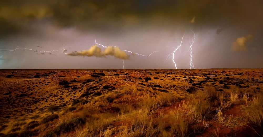 Lightning over sand dunes