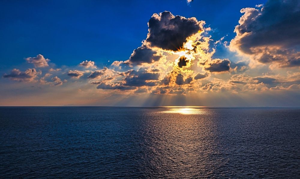 Clouds and sun rays on the sea