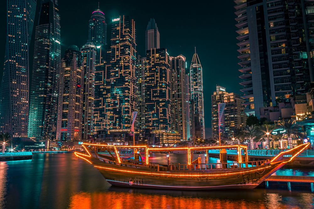 Old boat near modern buildings