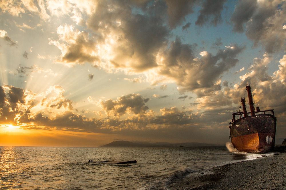 Sunset and ship Rio on the shore