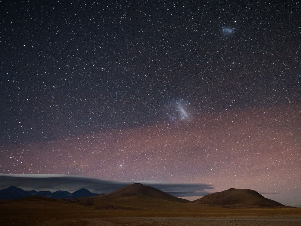 Canopus and Magellanic Clouds rises above Andes
