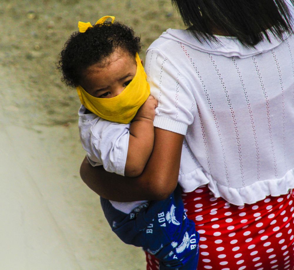 Covid-19 Postcards Venezuela a protected people, with the use of a mask and gloves