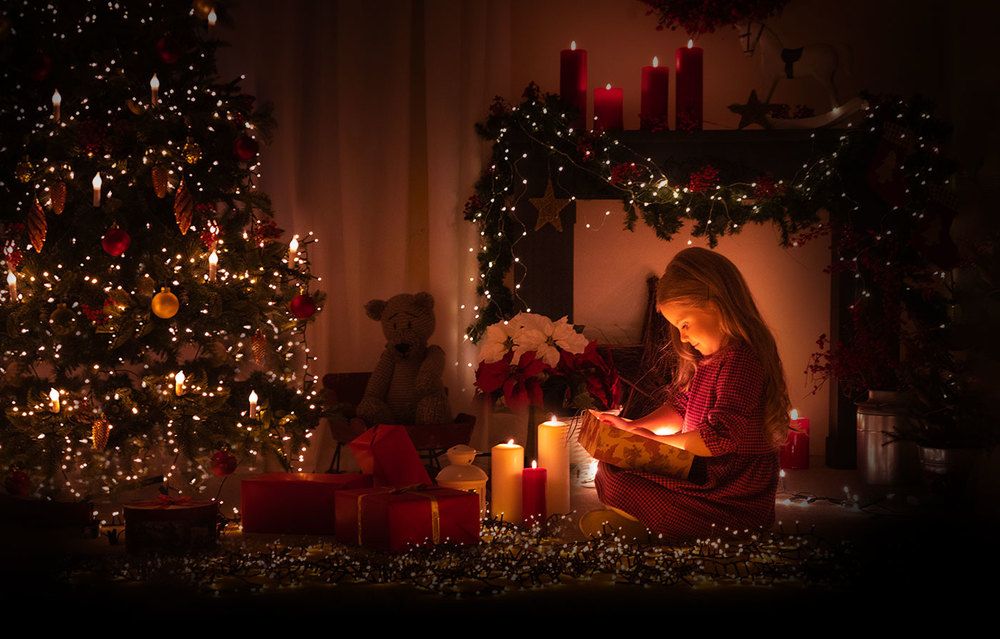 Girl unwrapping a christmas present