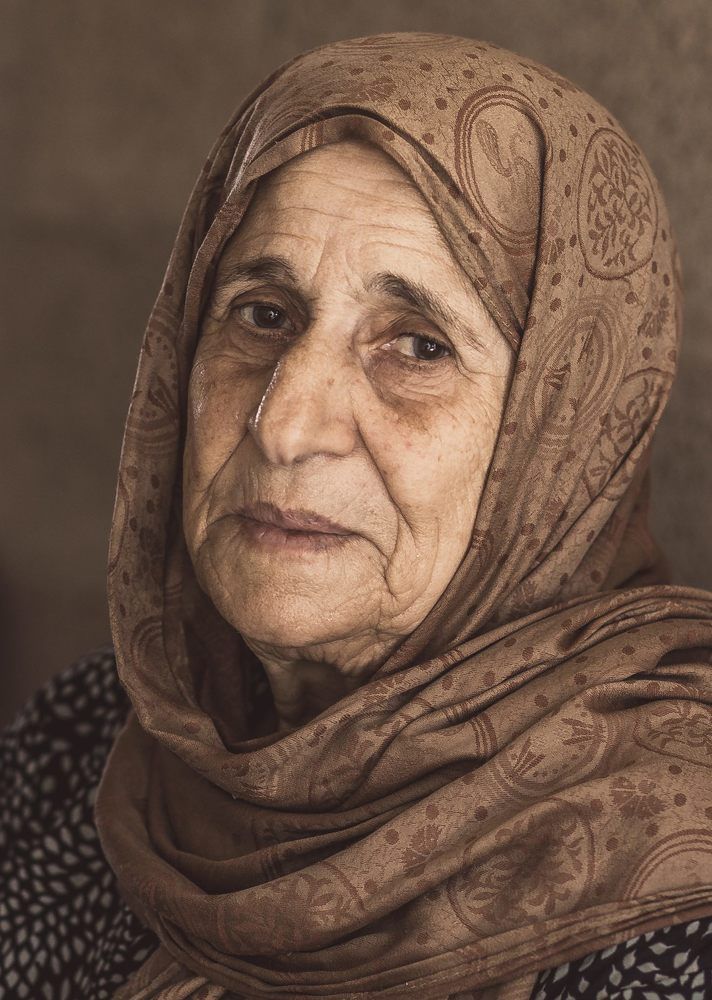 An elderly Palestinian woman in a refugee camp