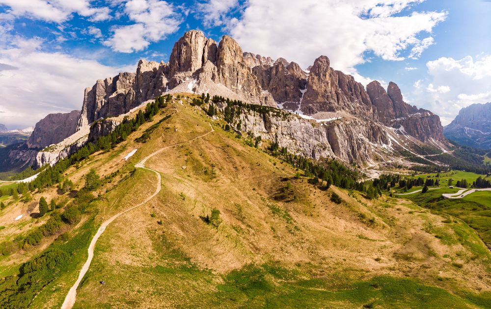 Dolomites - Beautiful panoramic sunset landscape at Gardena Pass, Passo Giau, near Ortisei. Stunning airial view on the top Dolomiti Alps Mountains from drone on summer day, Italy, south Tyrol Europe