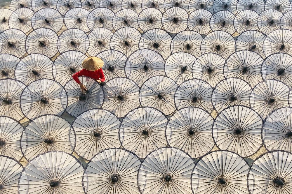 A woman making umbrellas