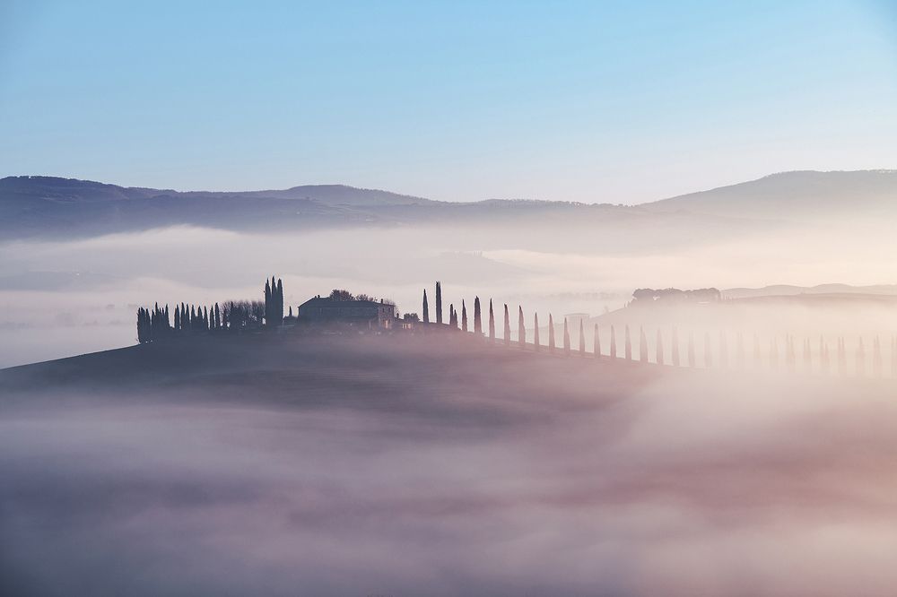 Tuscan farm in the fog