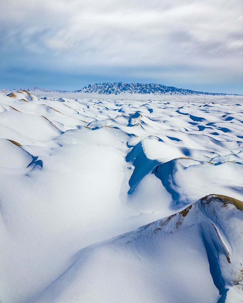 Snow covered sand dunes. Mongolia