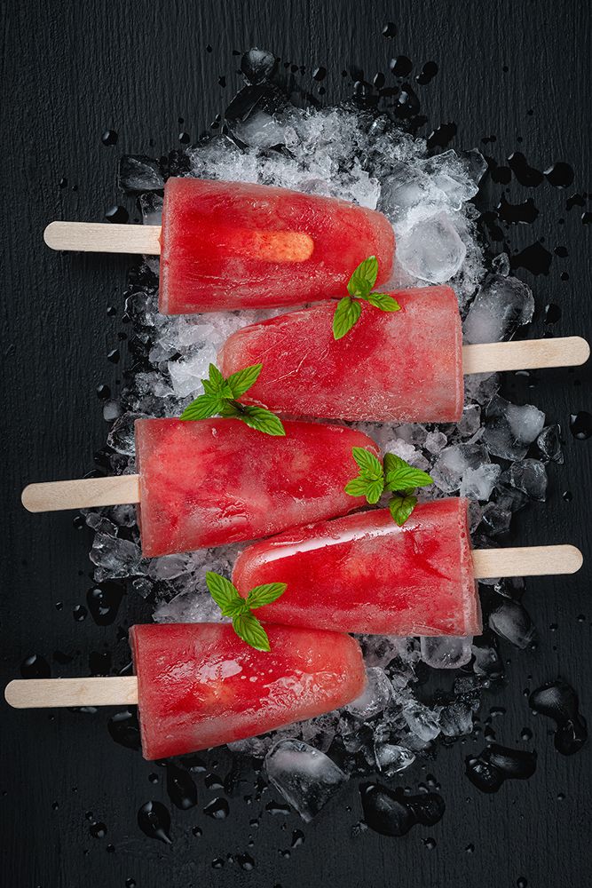 Watermelon ice cream on black wooden table
