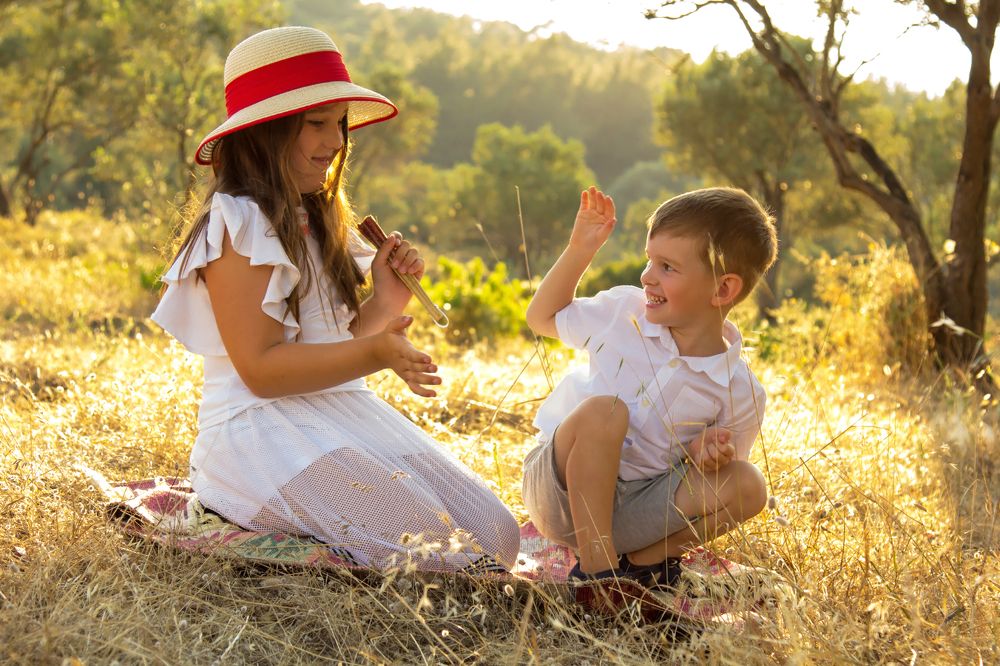 Brother and sister games in the clearing.