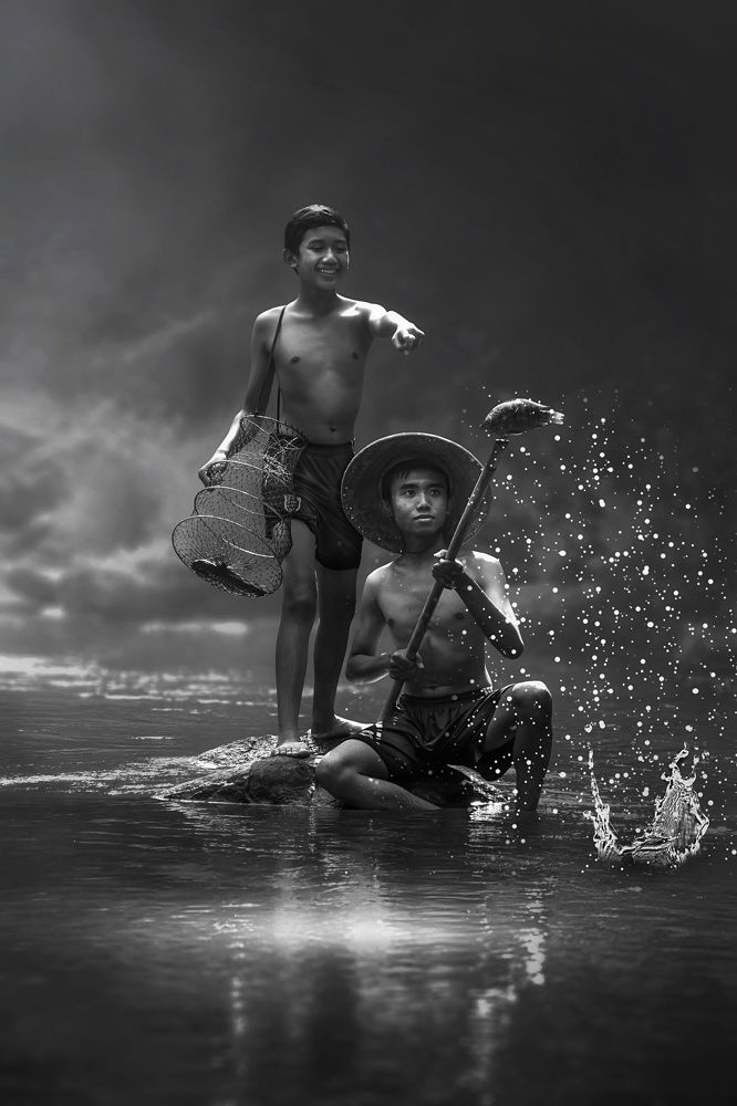 Catch fish in the river with friend