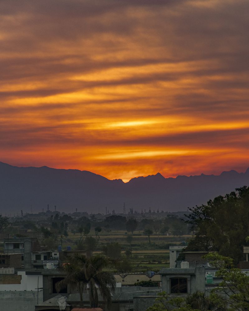 Fiery Sunrise behind Mountains