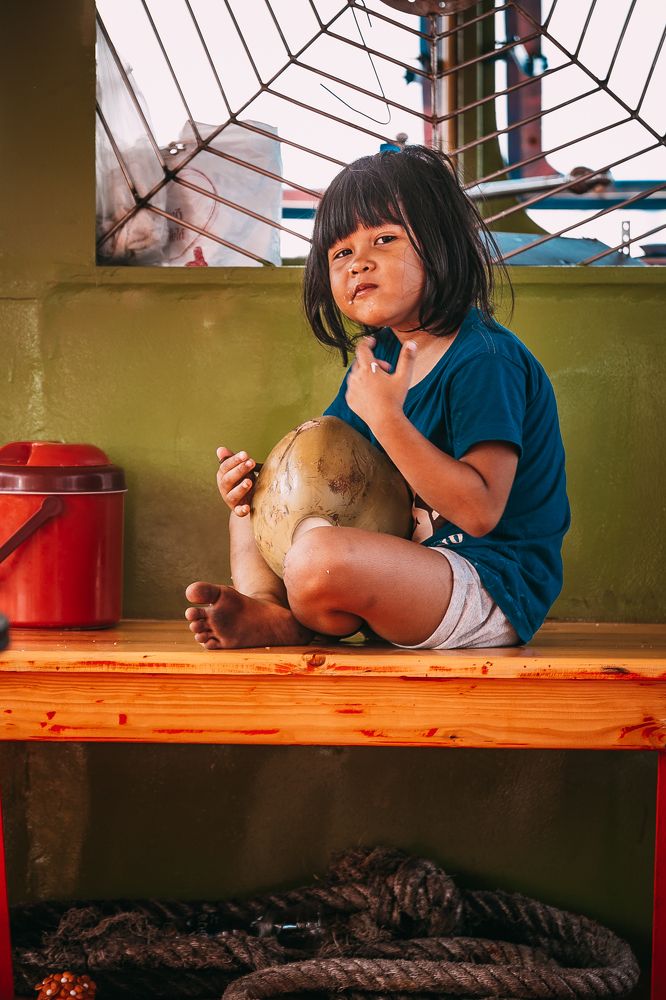 Thai girl eats coconut