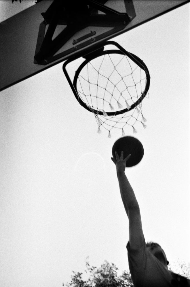 Basketball Player Throws the Ball