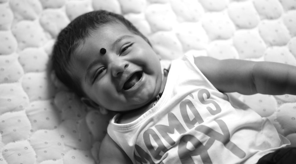 Happiness is your baby’s first toothless smile