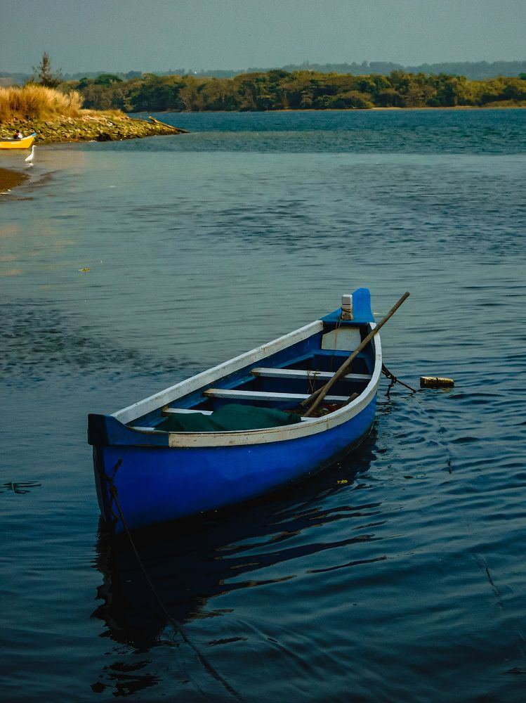 Blue boat on blue water......